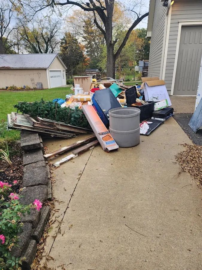 Dumpster being loaded with debris for 30 Yard Dumpster Rental in Homeland